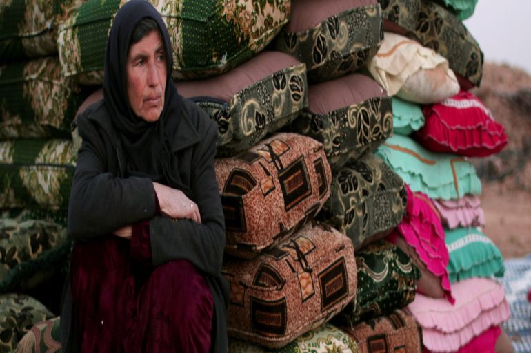 blogs - Syrian woman rests near cushions in Manbij city
