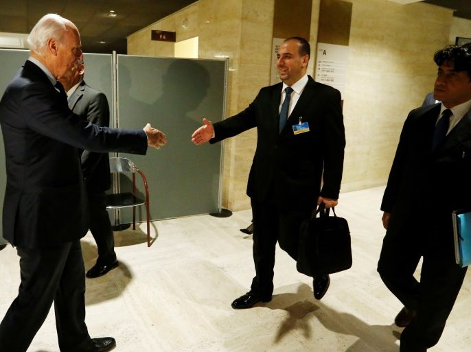 Nasr al-Hariri (R), chief negotiator of the Syrian High Negotiations Committee (HNC) opposition group, shakes hands with UN Special Envoy of the Secretary-General for Syria Staffan de Mistura prior to a round of negotiations, during the Intra-Syrian talks, at the European headquarters of the United Nations in Geneva, Switzerland March 24, 2017. REUTERS/Denis Balibouse