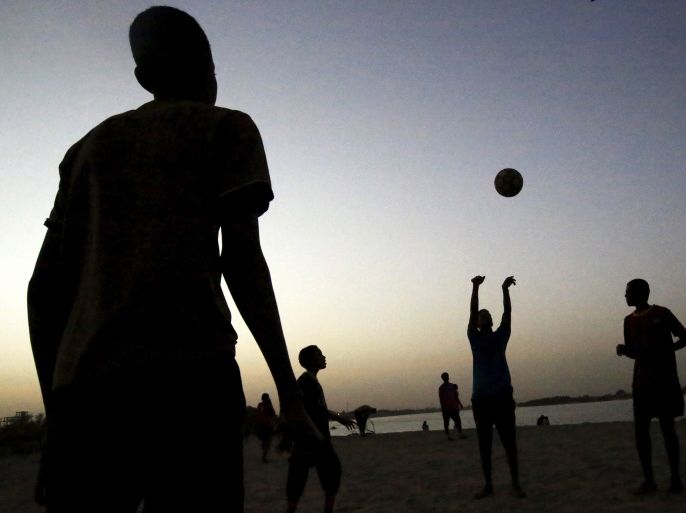 Boys play volleyball on the banks of the River Nile as the sun sets in Khartoum, Sudan, May 16, 2015. In Sudan, which faces insurgences in the western region of Darfur and along its border with breakaway South Sudan, as well as double-digit inflation and high unemployment, life goes on for young people in the capital Khartoum. As well as studying, for those who can afford it, the urban young of Sudan play football and netball, swim and fish in the nearby River Nile, attend prayers at local mosques and enjoy concerts or family celebrations. Other entertainment includes watching U.K. football matches and films on TV, with Facebook being ever popular for chatting amongst friends. REUTERS/Mohamed Nureldin AbdallahPICTURE 28 OF 28 FOR WIDER IMAGE STORY