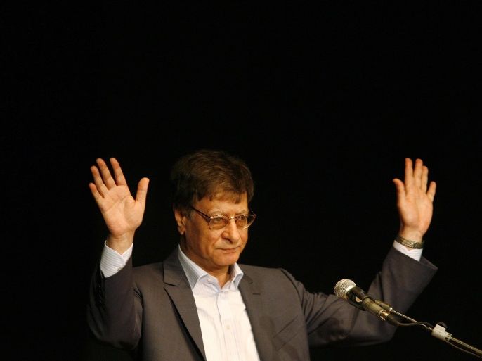 HAIFA, ISRAEL - JULY 15: Palestinian poet and journalist Mahmoud Darwish reads during his poetry show July 15, 2007 in Haifa, Israel. Darwish, seen as a symbol of Palestinian nationalism, made his first appearance in Israel on Sunday since his self-imposed exile from Israel, where he lived until 1971. (Photo by Gil Cohen Magen-Pool/Getty Images)