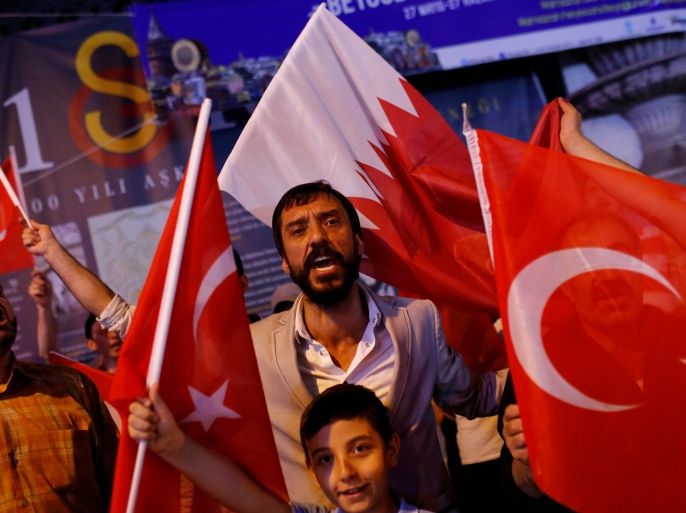 People shout slogans as they hold Turkish and Qatari flags during a demonstration in favour of Qatar in central Istanbul, Turkey, late June 7, 2017. REUTERS/Murad Sezer