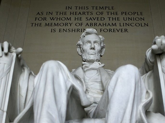 U.S. President Abraham Lincoln's statue at the Lincoln Memorial is seen in Washington March 27, 2015. The 170 ton, 19 foot high statue, formed from 28 blocks of Georgia marble, was sculpted by Daniel Chester French and dedicated in 1922. On April 15 the United States commemorates the 150th anniversary of President Abraham Lincoln's assassination. Events will include the re-enactment of his funeral in Springfield, Illinois, as well as talks and plays at Ford's Theatre in Washington D.C., where Confederate sympathiser John Wilkes Booth shot him in 1865. Lincoln, who kept the Union together in the American Civil War and helped secure the end of slavery, has enduring appeal both in the United States and worldwide: his life is celebrated at the Lincoln Memorial in Washington D.C., five-dollar bills carry his image and Stephen Spielberg directed the 2012 film bearing the 16th president's name. REUTERS/Gary CameronPICTURE 7 OF 30 FOR WIDER IMAGE STORY 'MEMORIES OF LINCOLN'SEARCH '150TH ASSASSINATION' FOR ALL IMAGES