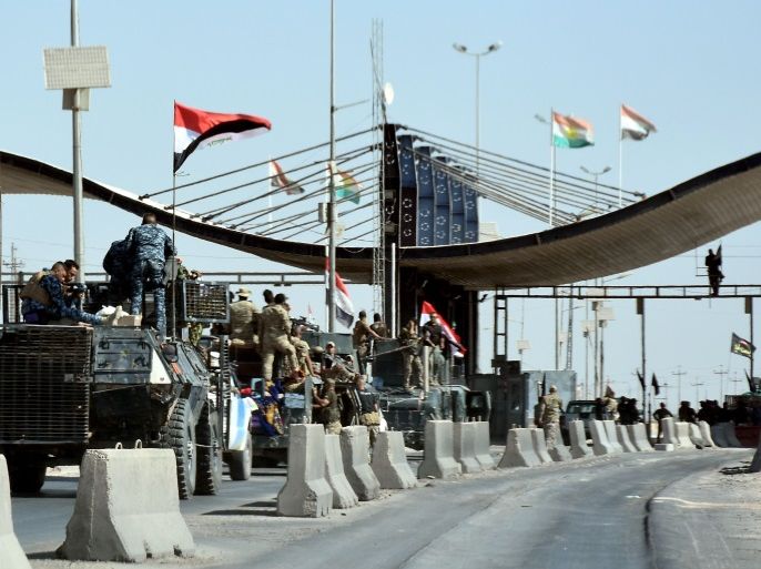 Iraqi forces are seen at the entrance to the military airport after they retook it from Kurdish fighters near the disputed city of Kirkuk on October 16, 2017, in a major operation sparked by a controversial independence referendum.Thousands of residents fled Kurdish districts of Kirkuk for fear of clashes after Iraqi military forces launched operations against Kurdish fighters near the northern city, an AFP journalist said. / AFP PHOTO / Marwan IBRAHIM (Photo credit should read MARWAN IBRAHIM/AFP/Getty Images)