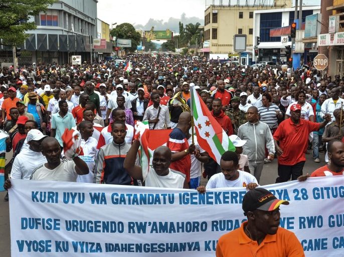 Burundians take to the streets to celebrate Burundi's withdrawal from the International Criminal Court (ICC) in Bujumbura, Brundi, on October 28, 2017. Thousands of Burundians on October 28 answered the government's call to celebrate the country's withdrawal from the International Criminal Court, cheering the 'historic' day using slogans such as 'bye bye ICC'. Burundi on October 27 became the first ever nation to leave the ICC, set up some 15 years ago to prosecute those behind the world's worst atrocities. / AFP PHOTO / STR (Photo credit should read STR/AFP/Getty Images)