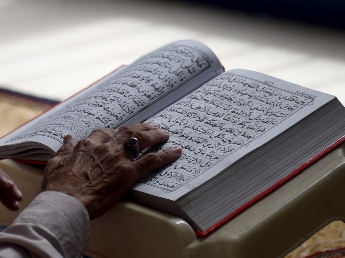 A Pakistani Muslim devotee recites the Quran at a mosque during the holy month of Ramadan in Karachi on June 13, 2016.Islam's holy month of Ramadan is celebrated by Muslims worldwide marked by fasting, abstaining from foods, sex and smoking from dawn to dusk for soul cleansing and strengthening the spiritual bond between them and the Almighty. / AFP / RIZWAN TABASSUM (Photo credit should read RIZWAN TABASSUM/AFP/Getty Images)