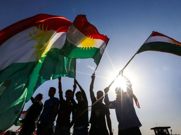 Iraqi Kurds wave flags of Iraqi Kurdistan during a demonstration outside the UN Office in Arbil, the capital of the autonomous region, on October 21, 2017, protesting against the escalating crisis with Baghdad. / AFP PHOTO / SAFIN HAMED (Photo credit should read SAFIN HAMED/AFP/Getty Images)