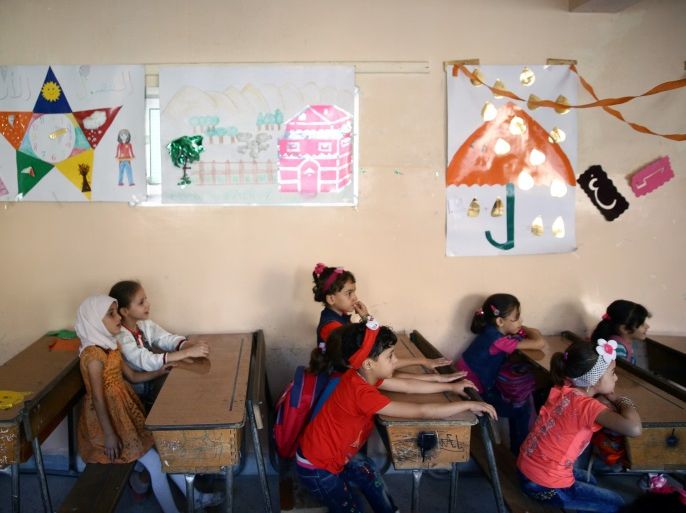 Students sit in a classroom on the first day of school in the rebel-held Douma neighbourhood of Damascus, Syria September 16, 2017. REUTERS/Bassam Khabieh