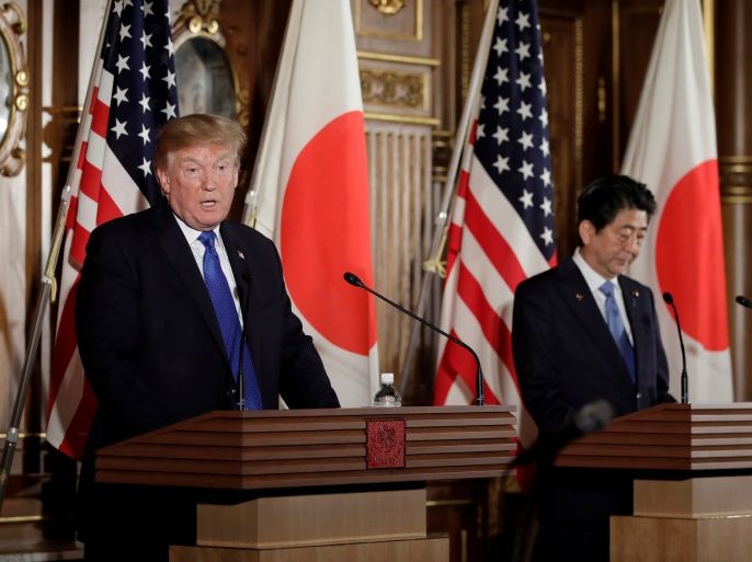 U.S. President Donald Trump speaks as Shinzo Abe, Japan's prime minister, looks on during a news conference at Akasaka Palace in Tokyo, Japan, November 6, 2017. REUTERS/Kiyoshi Ota/Pool