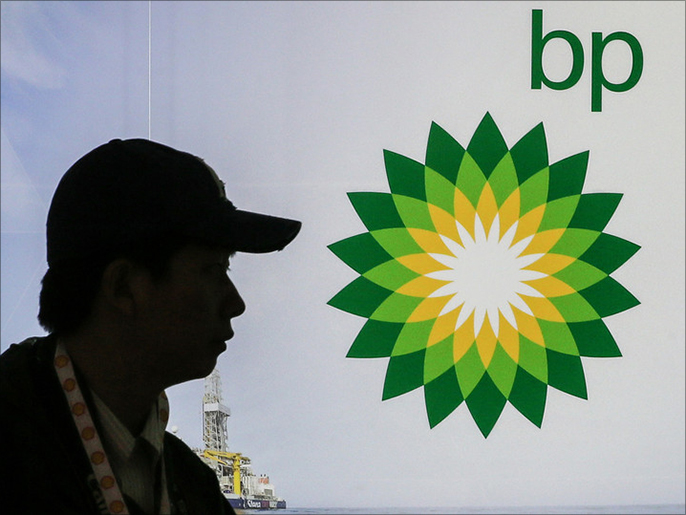 (FILE) A file photo dated 16 June 2014 showing a visitor passing a logo of the British multinational oil and gas company, BP during the 21st World Petroleum Congress (WPC) in Moscow, Russia.