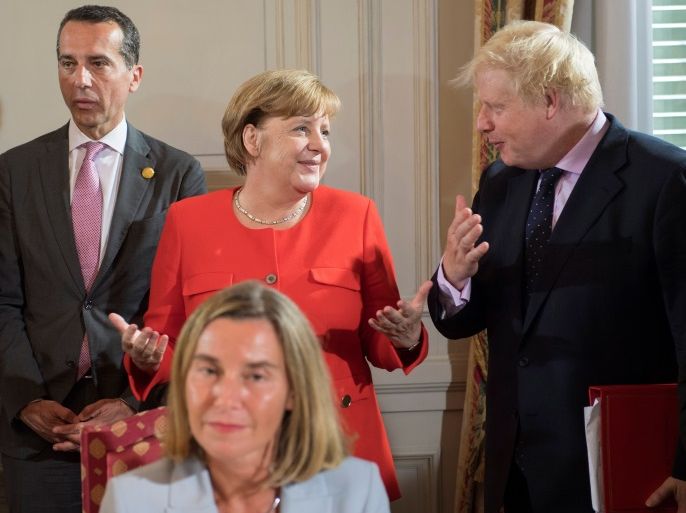 German Chancellor Angela Merkel, Britain's Foreign Secretary Boris Johnson and Austria's Chancellor Christian Kern during a summit of six Western Balkan countries in Triest, Italy July 12 2017. Guido Bergmann/Courtesy of Bundesregierung/Handout via REUTERS ATTENTION EDITORS - THIS PICTURE WAS PROVIDED BY A THIRD PARTY. NO RESALES. NO ARCHIVE