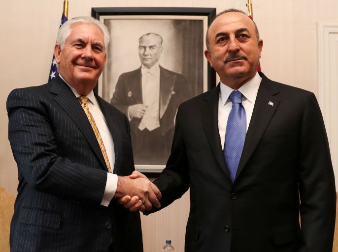 Turkish Foreign Minister Mevlut Cavusoglu shakes hands with U.S. Secretary of State Rex Tillerson in Ankara, Turkey, February 16, 2018. REUTERS/Cem Ozdel/Pool