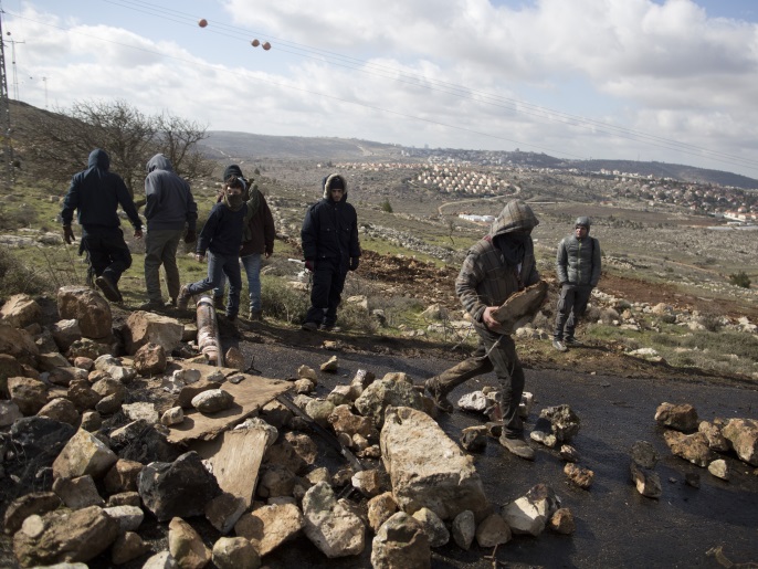 AMONA, WEST BANK - FEBRUARY 01: Israeli settlers block an entrance ahead of the upcoming eviction of the illegal Jewish settlement on February 1, 2017 in Amona, West Bank. Israeli Security forces have started evacuating residents from the illegal outpost of Amona in the West Bank on Wednesday, after hundreds of youths streamed into the outpost to fight the evacuation. (Photo by Lior Mizrahi/Getty Images)