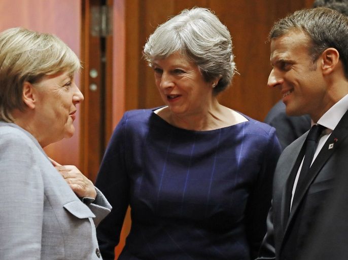 BRUSSELS, BELGIUM - OCTOBER 19: German Chancellor Angela Merkel, Britain's Prime Minister Theresa May and French President Emmanuel Macron arrive for a round table meeting on October 19, 2017 in Brussels, Belgium. Under discussion are the Iran Nuclear Deal, Brexit and North Korea. Mrs May has offered assurances to EU nationals that her government will make it as easy as possible to remain living in the United Kingdom after Brexit. (Photo by Dan Kitwood/Getty Images)