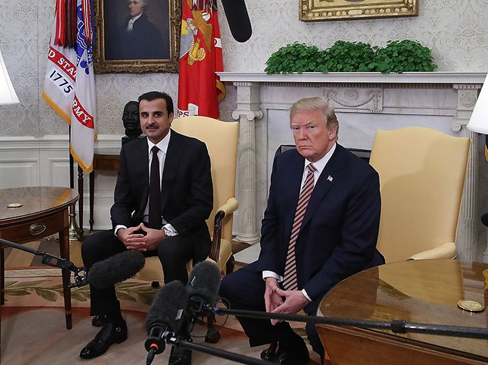 epa06659900 US President Donald J. Trump during a meeting with the Emir of Qatar Sheikh Tamim bin Hamad Al Thani (L), in the Oval Office at the White House, in Washington, DC, USA, 10 April 2018. President Trump has announced that he canceled his upcoming trip to the 8th annual Summit of the Americas in Lima, Peru. EPA-EFE/Mark Wilson / POOL