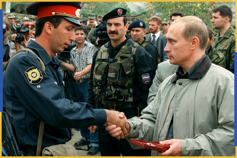 فلاديمير بوتين يكرم أحد رجال قوات داغستان (رويترز)