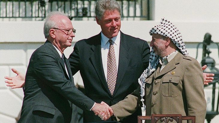 epa000311128 (FILES) Picture dated 1993 shows Palestinian President Yasser Arafat (R) in his historic handshake with Israeli Prime Minister Yitzhak Rabin (L) on the White House lawn as the two leaders are brought together by US President Bill Clinton. Yasser Arafat, revered as the champion of Palestinian statehood and reviled as a terrorist, died Thursday, 11 November 2004, at the age of 75, spreading spasms of grief among Palestinians and rekindling calls for new peace talks with Israel. Arafat's death marked a turning point in modern Middle East history, leaving the Palestinians without a strong leader for the first time in four decades an