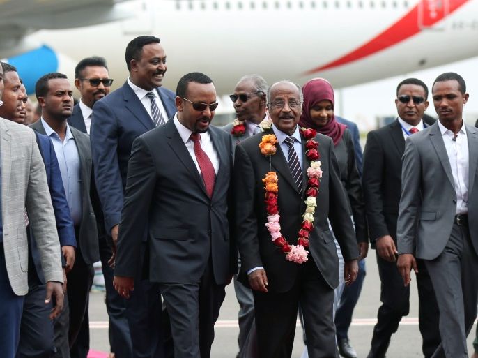 Ethiopia's Prime Minister Abiy Ahmed welcomes Eritrean Foreign Minister Osman Saleh and his delegation at the Bole International Airport in Addis Ababa, Ethiopia June 26, 2018. REUTERS/Tiksa Negeri