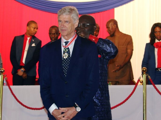 Liberia's President George Weah awards his country's highest honor to his former football coach Arsene Wenger and former Arsenal manager, during a ceremony at Samuel Kanyon Doe Sports Complex in the capital Monrovia, Liberia August 24, 2018. REUTERS/James Giahyue