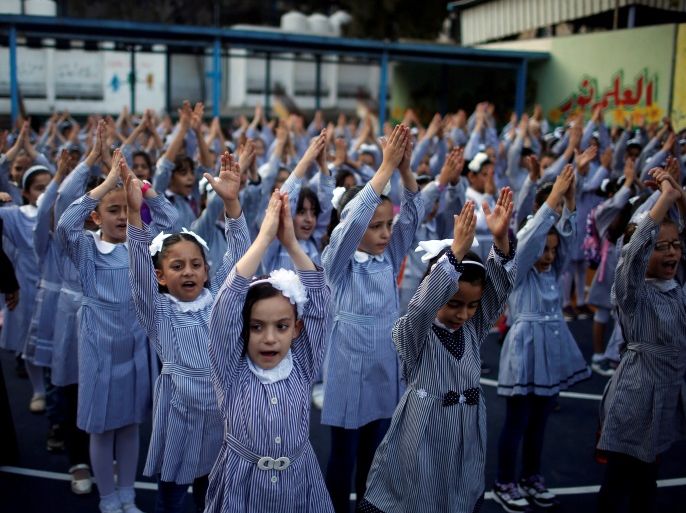 Palestinian schoolgirls participate in the morning exercise at an UNRWA-run school, on the first day of a new school year, in Gaza City August 29, 2018. REUTERS/Mohammed Salem TPX IMAGES OF THE DAY