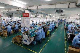 Employees work at the assembly line inside TMB's mobile phone battery manufacturing plant in Noida, India, October 12, 2018. Picture taken October 12, 2018. REUTERS/Anushree Fadnavis