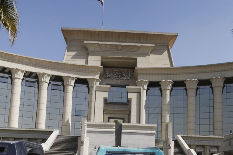 A member of the special forces police stands guard in front of the Supreme Constitutional Court in Cairo, March 1, 2015, during a court session to determine if the House of Representatives parliamentary election law is constitutional. Egypt's Supreme Election Committee said on Sunday it was working on a
