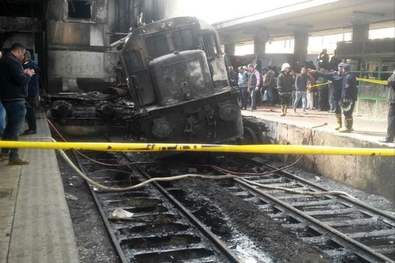 Train Accident in Cairo- - CAIRO, EGYPT - FEBRUARY 27 : Fire fighters and onlookers gather at the scene of a fiery train crash at the Egyptian capital Cairo's main railway station on February 27, 2019. The accident, which sparked a major blaze at the Ramses station, leaves at least 20 dead and 40 others injured.