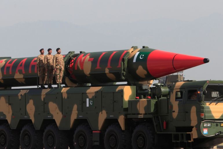 Pakistani military personnel stand beside a Shaheen III surface-to-surface ballistic missile during Pakistan Day military parade in Islamabad, Pakistan, March 23, 2017. REUTERS/Faisal Mahmood