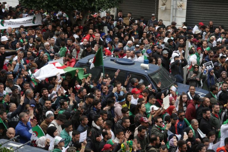 Protest against candidacy of President Abdelaziz Bouteflika for a fifth term in Algeria- - ALGIERS, ALGERIA - MARCH 08: Thousands of people stage a protest march against candidacy of President Abdelaziz Bouteflika for a fifth term in Algiers, Algeria on March 08, 2019. 81-year-old Abdelaziz Bouteflika, serving as the president since 1999, has announced on 19 February he will be running for a fifth term in presidential elections.