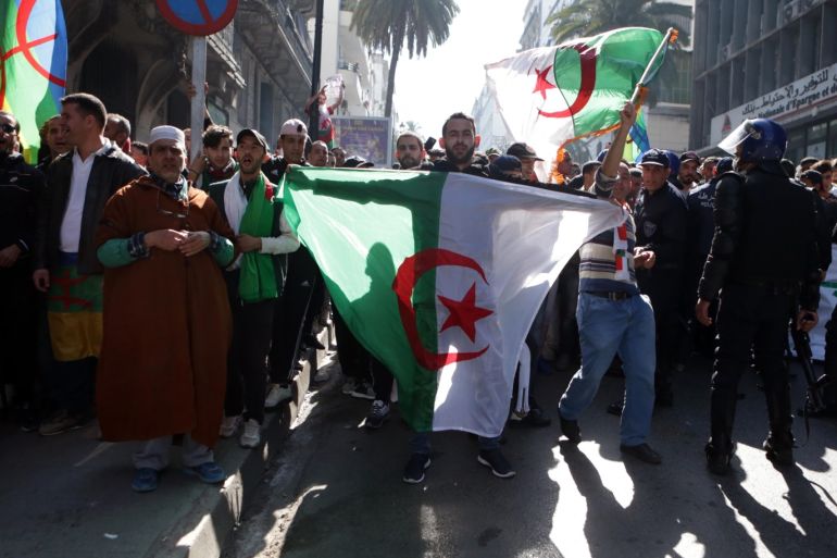 Anti-Bouteflika protests continue in Algeria- - ALGIERS, ALGERIA - MARCH 29: Police officers block the road as thousands of people stage a demonstration to demand the resignation of Algerian President Abdelaziz Bouteflika on March 29, 2019 in Algiers, Algeria.