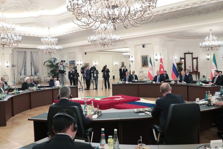 epa07846982 A handout picture provided by Turkish Presidential press office shows Turkish President Recep Tayyip Erdogan (back-R), Russian President Vladimir Putin (L) and Iranian President Hassan Rouhani (R) attend their summit in Ankara, Turkey, 16 September 2019. Erdogan, Putin and Rouhani are in Ankara for a trilateral meeting for Syria talks. EPA-EFE/MURAT CETINMUHURDAR/TURKISH PRESIDENTIAL PRESS OFFICE HANDOUT HANDOUT EDITORIAL USE ONLY/NO SALES