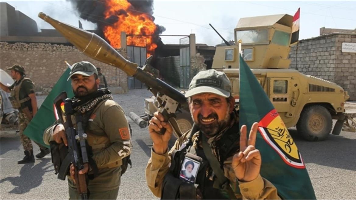 الحشد الشعبي العراقي، قوة قتالية موازية للجيش، تعلن بعض وحداته استعدادها للقتال إلى جانب إيران (غيتي)