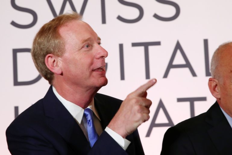 Microsoft Chairman Brad Smith and Swiss President Ueli Maurer wait for a news conference after the Swiss Global Digital Summit in Geneva, Switzerland, September 2, 2019. REUTERS/Denis Balibouse