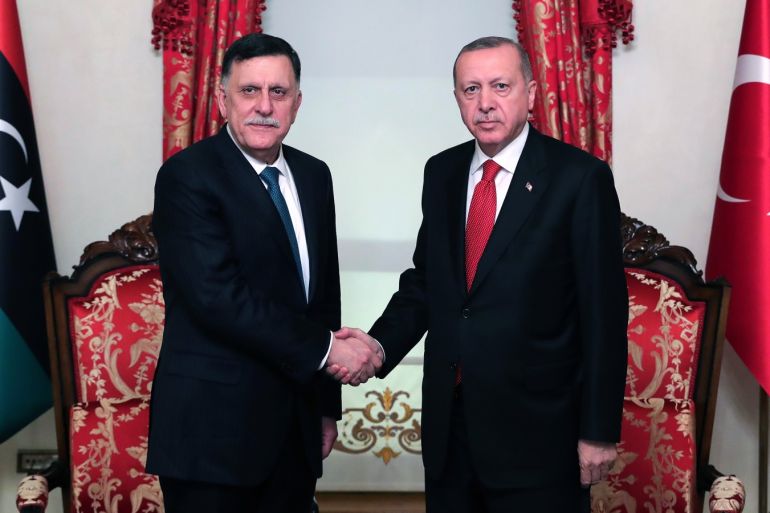 President of Turkey Erdogan meets Fayez Al-Sarraj- - ISTANBUL, TURKEY - NOVEMBER 27: President of Turkey, Recep Tayyip Erdogan (R) shakes hands with Leader of Libya’s UN-recognized government, Fayez Al-Sarraj (L) as they pose for a photo at Dolmabahce Office in Istanbul, Turkey on November 27, 2019.