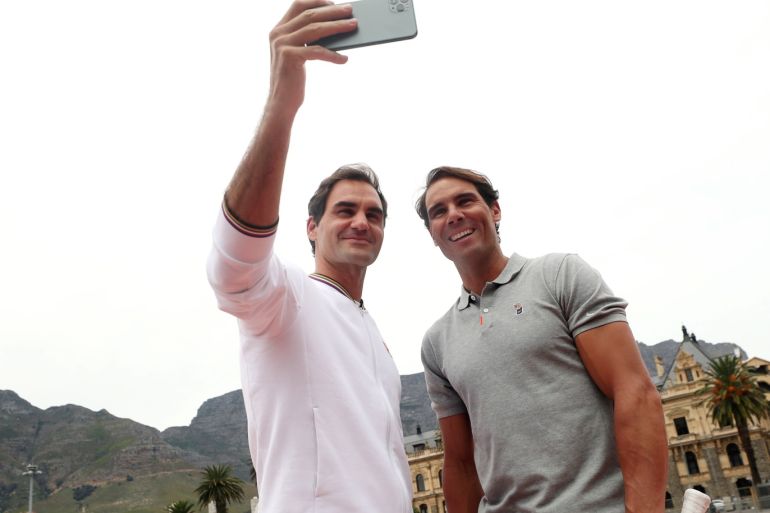 Roger Federer and Rafael Nadal take a selfie in front of Cape Town's iconic Table Mountain during a photo session ahead of their