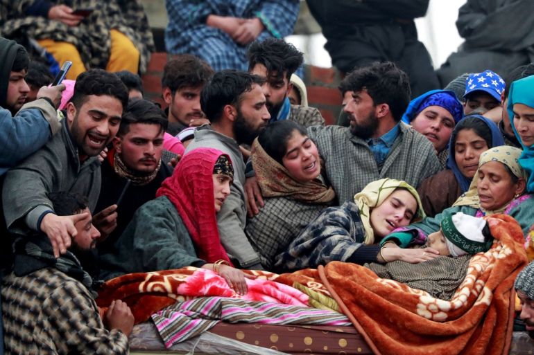 SENSITIVE MATERIAL. THIS IMAGE MAY OFFEND OR DISTURB People surround the body of Adil Ahmad Dar, a suspected militant, who according to local media was killed in a gun battle with Indian security forces, during his funeral in Arwani, in south Kashmir's Kulgam district, January 7, 2020. REUTERS/Danish Ismail TPX IMAGES OF THE DAY