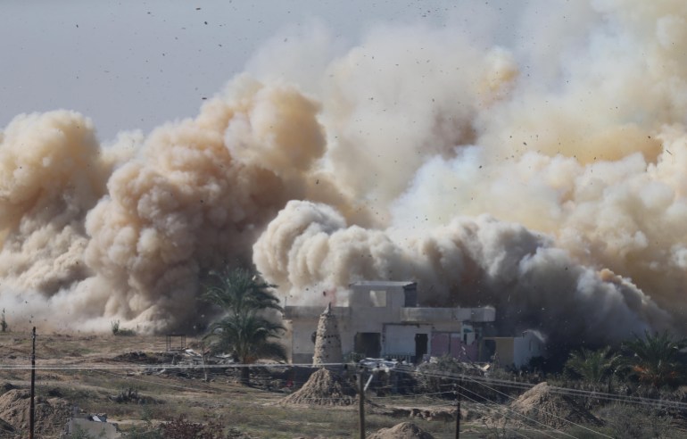 Smoke rises as a house is blown up during a military operation by Egyptian security forces in the Egyptian city of Rafah, near the border with southern Gaza Strip