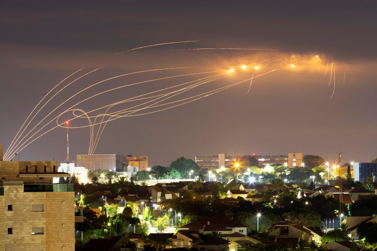 Iron Dome anti-missile system fires interception missiles as rockets are launched from Gaza towards Israel, as seen from the city of Ashkelon