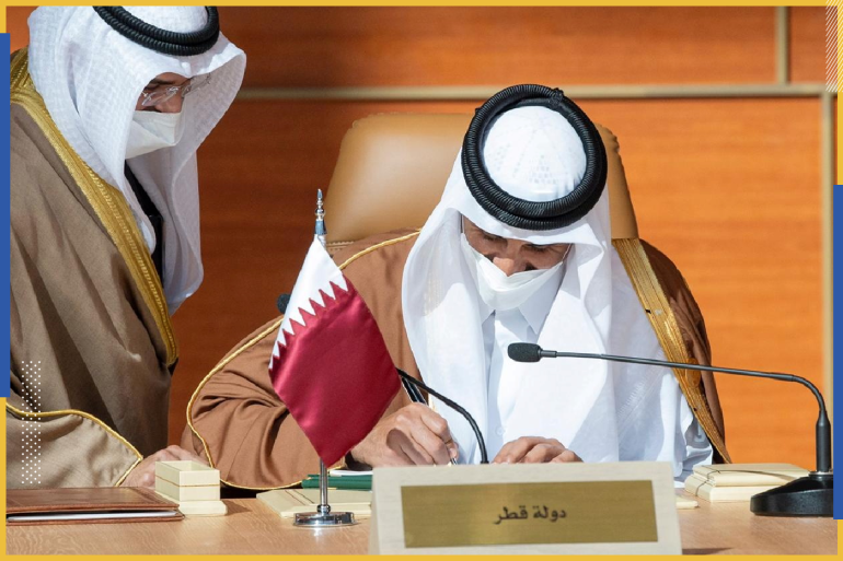 Qatar's Emir Sheikh Tamim bin Hamad al-Thani signs a document during the Gulf Cooperation Council's (GCC) 41st Summit in Al-Ula, Saudi Arabia January 5, 2021. Bandar Algaloud/Courtesy of Saudi Royal Court/Handout via REUTERS ATTENTION EDITORS - THIS PICTURE WAS PROVIDED BY A THIRD PARTY