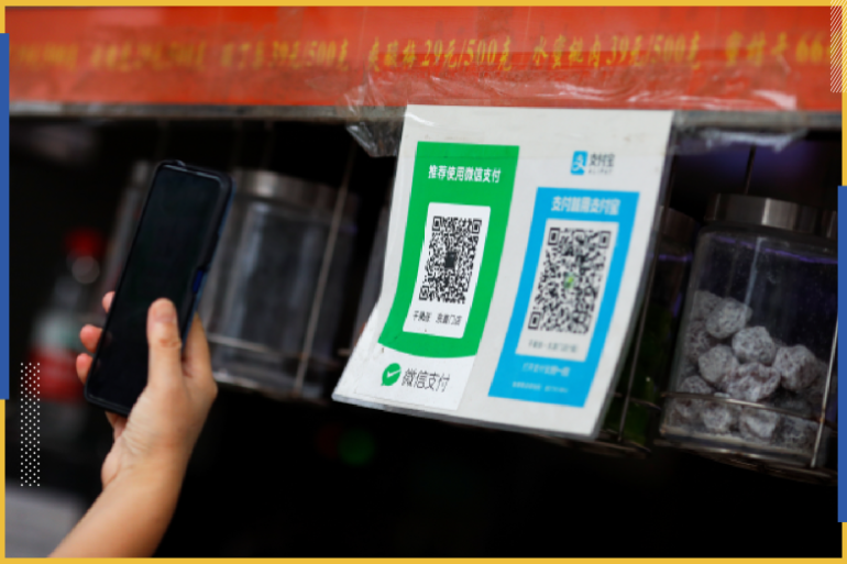 QR codes of the digital payment services WeChat Pay and Alipay are seen at a shop in Beijing, China August 6, 2020. REUTERS/Thomas Peter