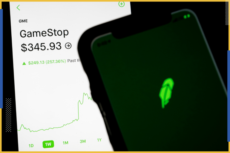 Trading information for GameStop is displayed on the Robinhood App as another screen displays the Robinhood logo in this photo illustration January 29, 2021. REUTERS/Brendan McDermid/Illustration