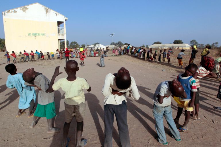 Children, who have fled Boko Haram violence in the northeast region of Nigeria, take part in aerobic exercises at Maikohi secondary school at the IDP camp in Yola
