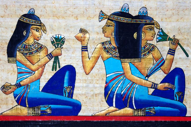 beautiful egiptian papyrus - three girls holding a lotus flower - beauty concept; Shutterstock ID 6638566; Department: online