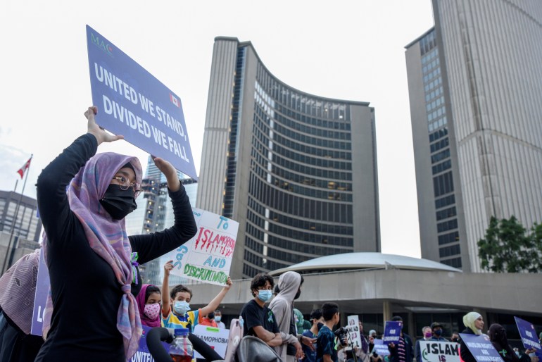 People attend a rally to highlight Islamophobia in Toronto