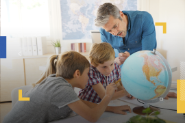 Teacher with kids in geography class looking at globe
