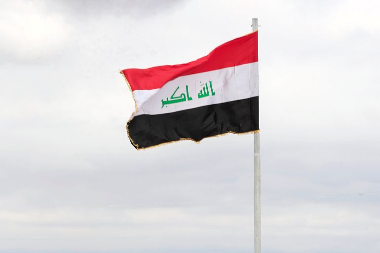 an Iraqi flag . REUTERS/Thaier al-Sudani
