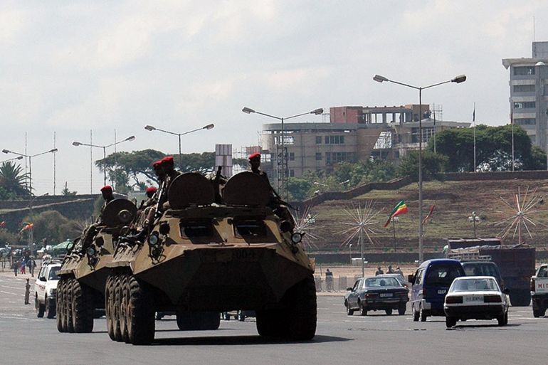 Ethiopian special forces patrol with armoured personnel carriers in Meskel Square. downtown Addis Ababa, Ethiopia, June 9, 2005. Ethiopian security forces held some opposition leaders under house arrest on Thursday, a day after police and troops fired into crowds killing at least 26 people in the country's worst bloodshed in four years. REUTERS/Andrew Heavens AH/RSS/DY