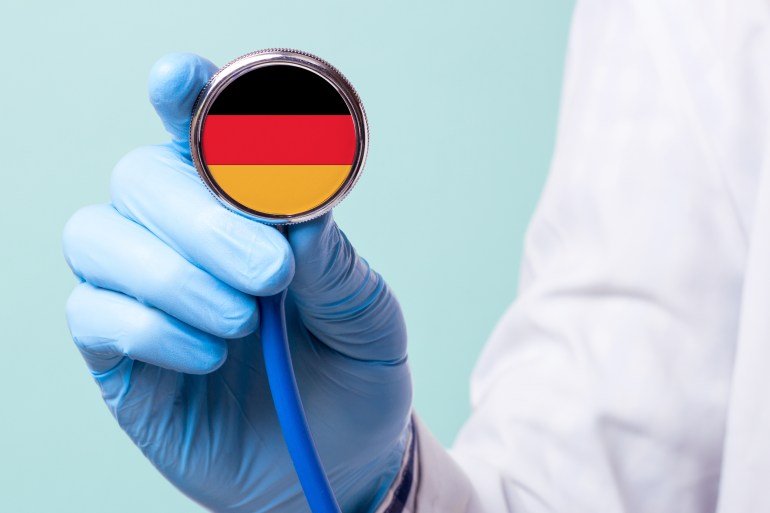 Medicine in Germany is free and paid. Expensive medical insurance. Treatment of disease at the highest level Doctor holding a stethoscope in his hand; Shutterstock ID 790303066; purchase_order: ajnet; job: ; client: ; other: