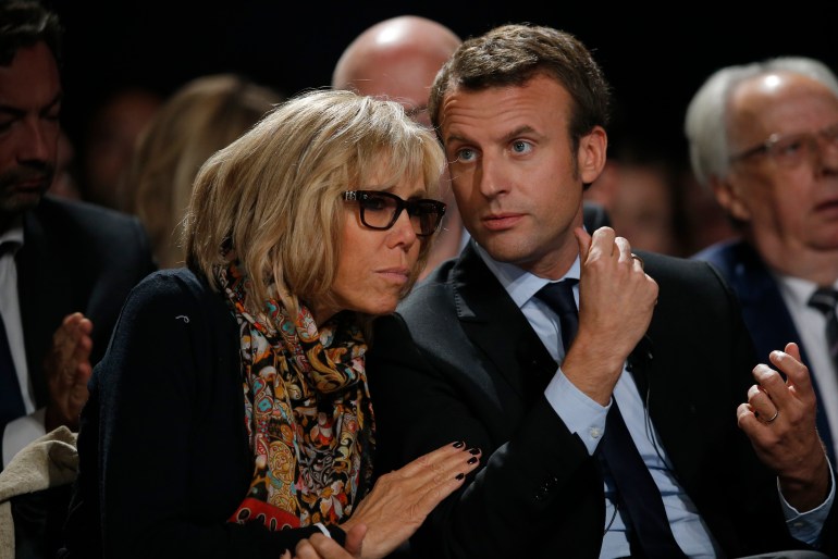 Former French economy minister Emmanuel Macron (R) and his wife Brigitte Trogneux attend a political rally for his political movement, En Marche !, or Forward !, in Le Mans, France, October 11, 2016. REUTERS/Stephane Mahe