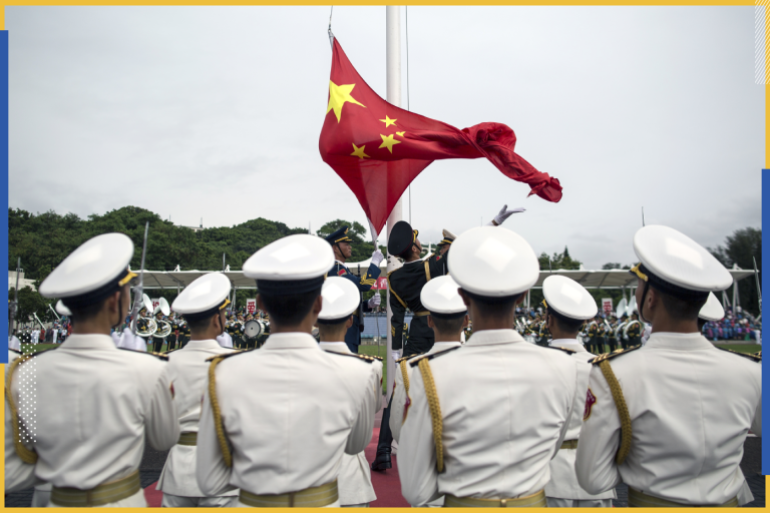 epa06083053 (FILE) - People's Liberation Army (PLA) soldiers participate in a flag raising ceremony during an open day at the PLA navy base in Hong Kong, China, 08 July 2017 (reissued 12 July 2017). According to reports, China ships carrying military personnel departed on 11 July 2017 from Zhanjiang, southern China and set sails to Djibouti. China is to establish it's fiorst ever overseas military base in the Djibouti, at the Horn of Africa. EPA/JEROME FAVRE