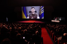 epaselect epa09953398 Ukraine's President Volodymyr Zelensky appears on a screen during the Opening Ceremony of the 75th annual Cannes Film Festival, in Cannes, France, 17 May 2022. The festival runs from 17 to 28 May. EPA-EFE/CLEMENS BILAN الأوروبية